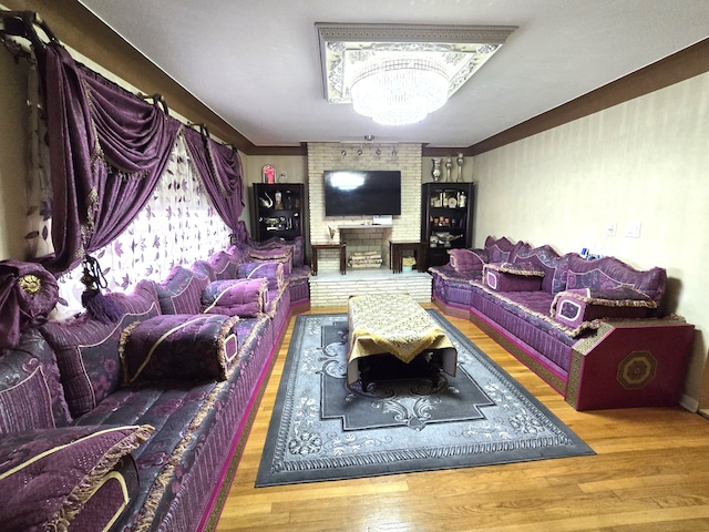 living room with a notable chandelier and hardwood / wood-style flooring