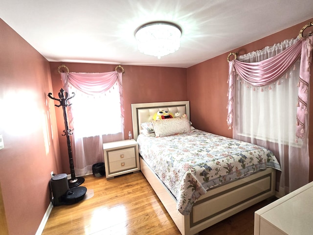 bedroom with light hardwood / wood-style floors