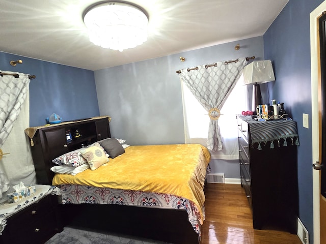 bedroom featuring dark hardwood / wood-style flooring