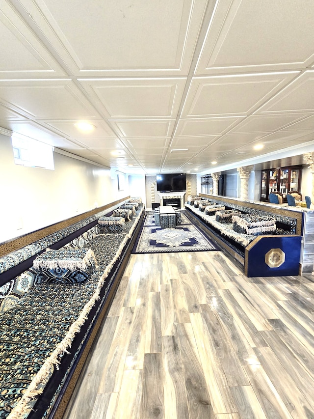 misc room with hardwood / wood-style flooring and coffered ceiling