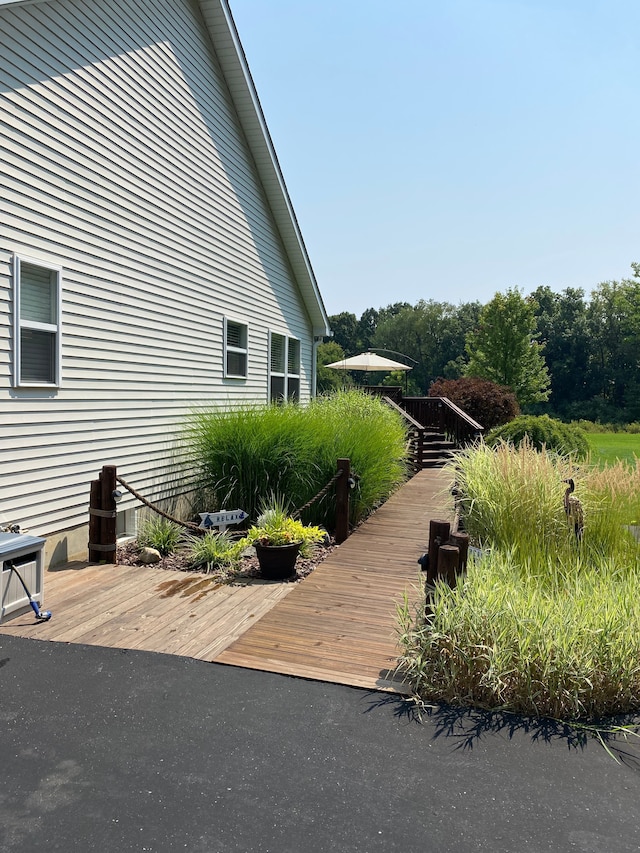 view of side of property with a deck