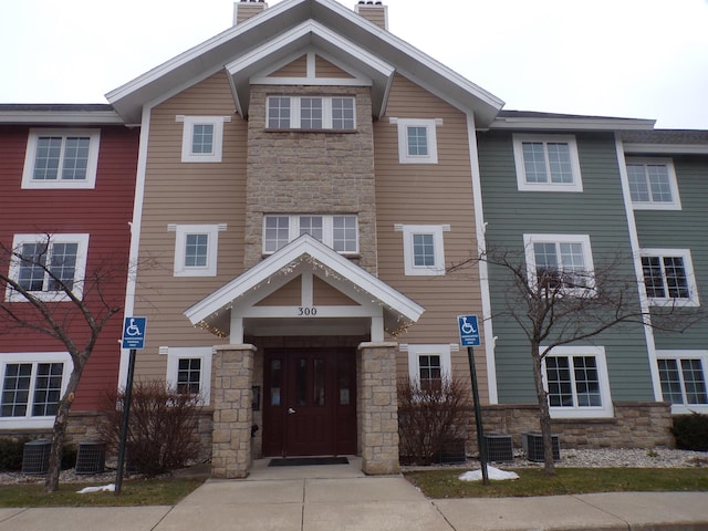 view of front of home featuring central AC unit