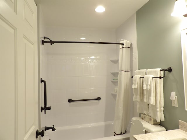 full bathroom with shower / bath combination with curtain, toilet, and vanity