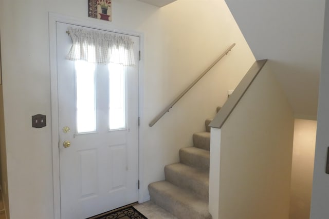 tiled foyer entrance featuring a wealth of natural light