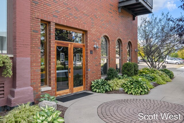 property entrance featuring french doors