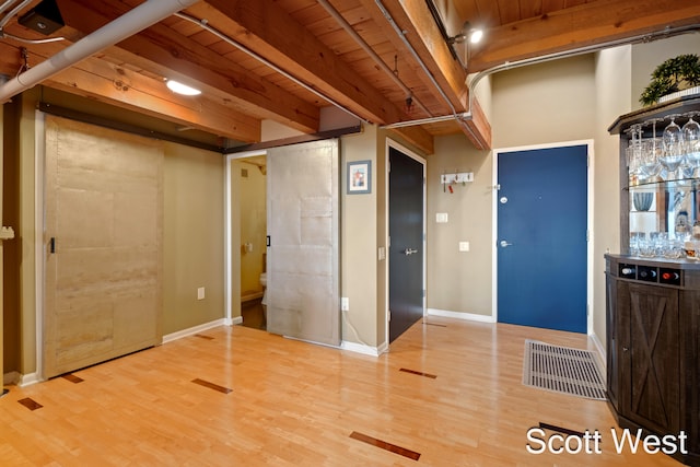 interior space with hardwood / wood-style floors and wood ceiling