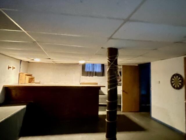 120 Oak St, Hillsdale, MI 49242 - indoor dry bar featuring a paneled ceiling and finished concrete floors