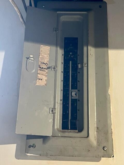 120 Oak St, Hillsdale, MI 49242 - utility room featuring electric panel
