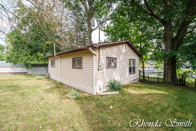 view of home's exterior featuring a yard