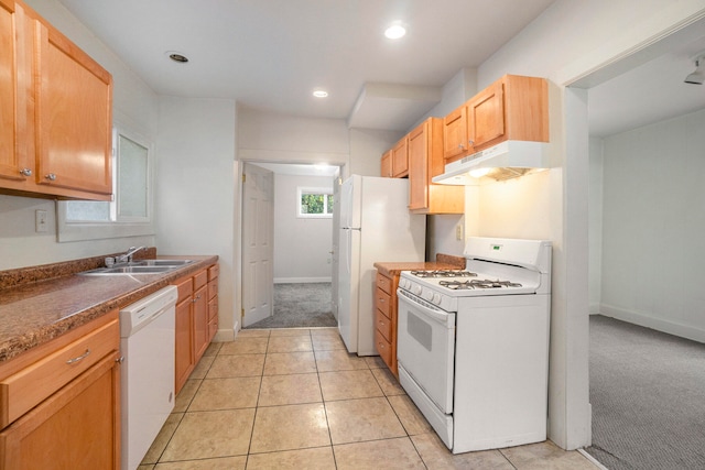 kitchen with sink, white appliances, and light tile patterned floors