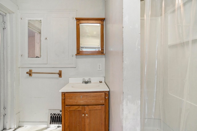 bathroom featuring vanity and walk in shower