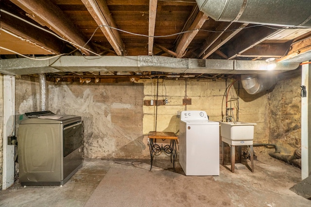 basement featuring sink and washer and clothes dryer