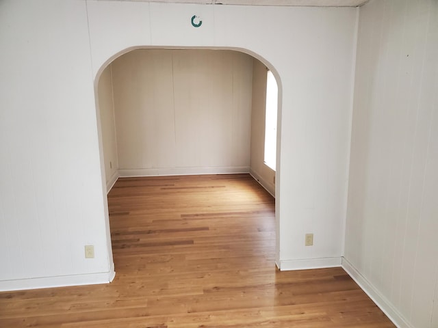 spare room with hardwood / wood-style floors