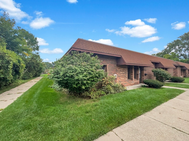 view of home's exterior featuring a lawn