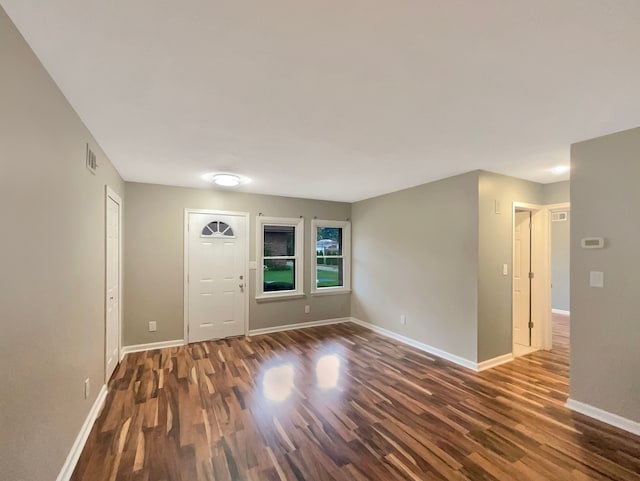 foyer entrance with dark wood-type flooring