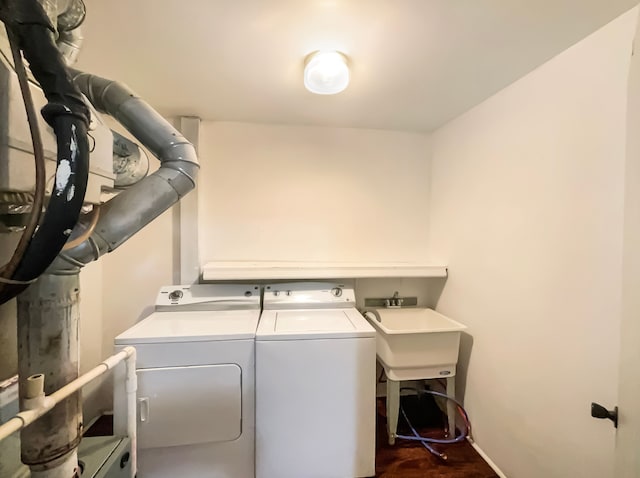 laundry area with washing machine and dryer and dark hardwood / wood-style floors