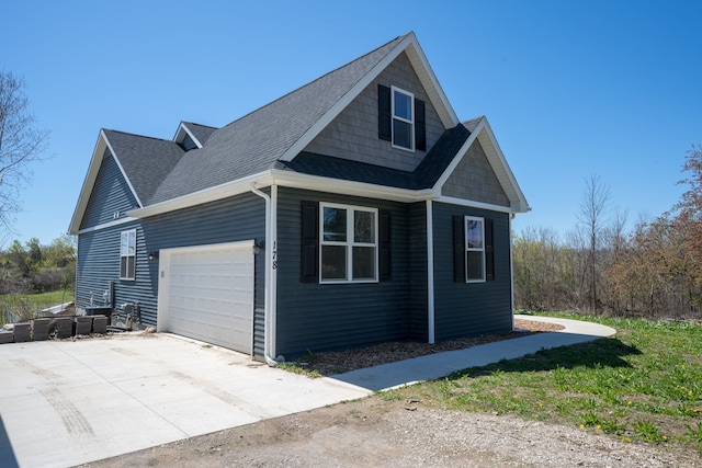 view of side of property featuring a garage