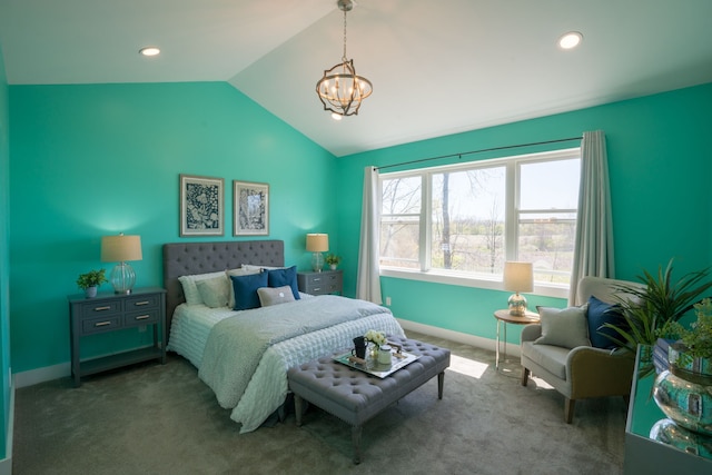 carpeted bedroom featuring an inviting chandelier and lofted ceiling