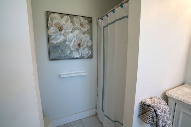 bathroom with tile patterned flooring, vanity, toilet, and a shower with shower curtain