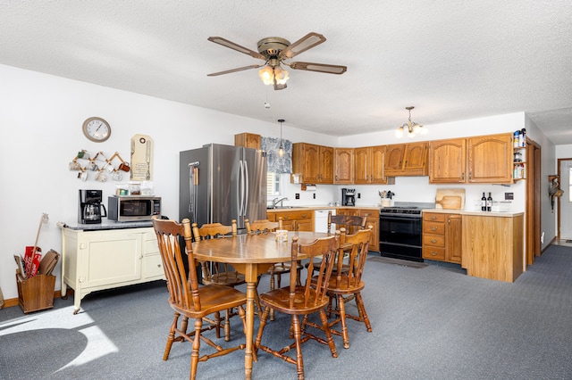 dining space with ceiling fan with notable chandelier, carpet, and a textured ceiling