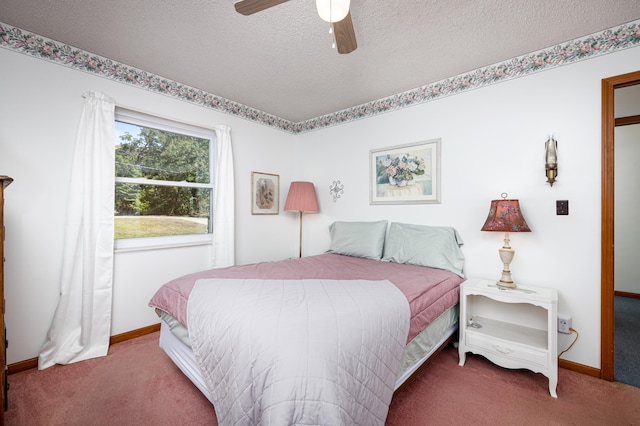 bedroom with ceiling fan, carpet, and a textured ceiling