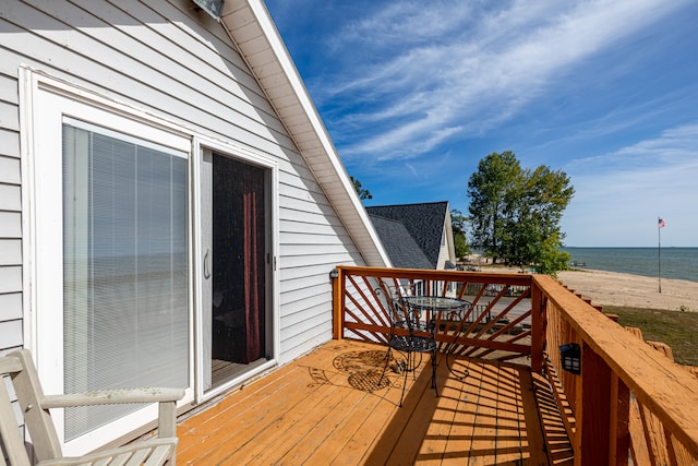 deck featuring a water view