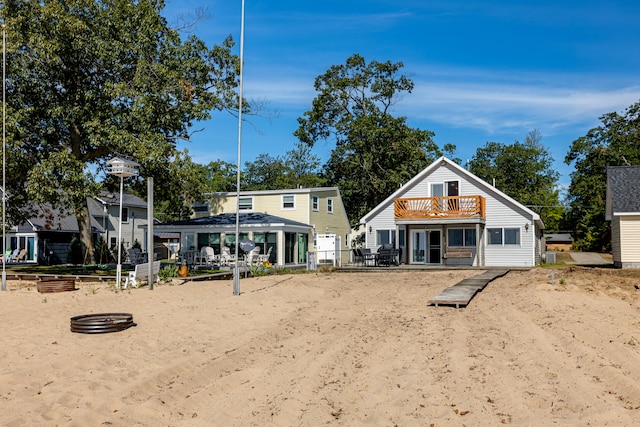 rear view of house with a balcony