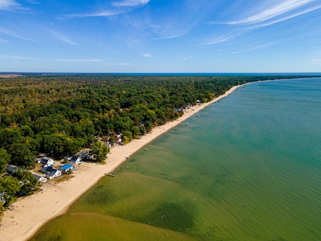 drone / aerial view featuring a view of the beach and a water view
