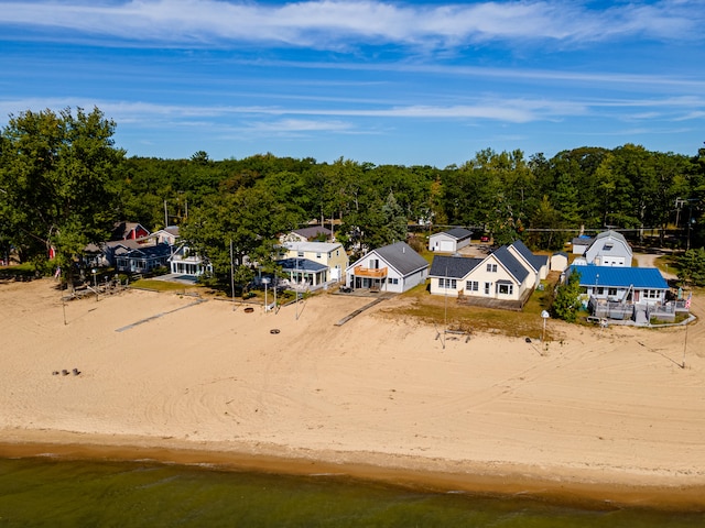 drone / aerial view with a view of the beach and a water view