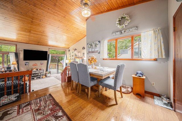 dining space featuring wood ceiling, light hardwood / wood-style floors, and lofted ceiling