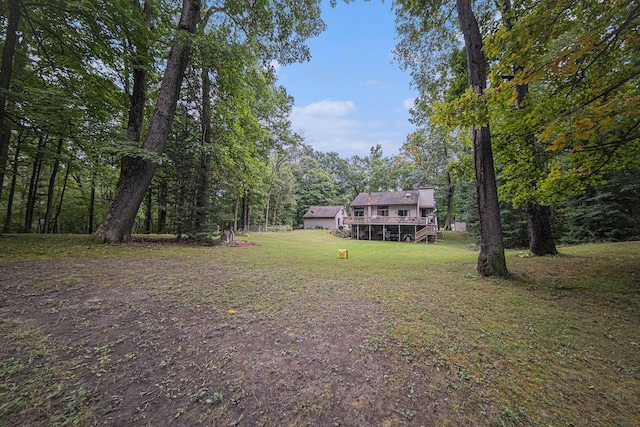 view of yard with a wooden deck