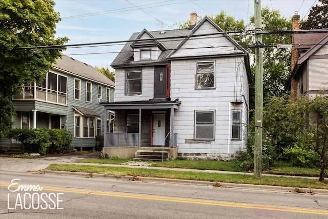318 Diamond Ave SE, Grand Rapids, MI 49506 - view of front of home with a porch and a chimney