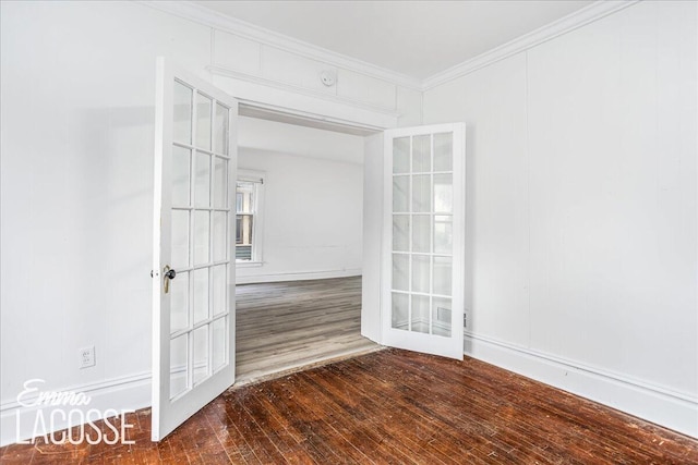 318 Diamond Ave SE, Grand Rapids, MI 49506 - spare room with french doors, wood finished floors, and ornamental molding