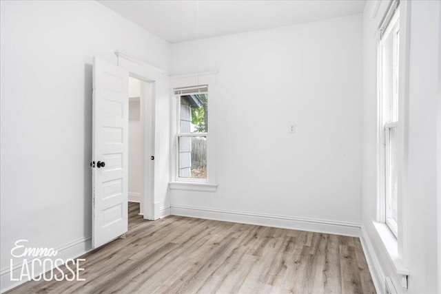 318 Diamond Ave SE, Grand Rapids, MI 49506 - empty room featuring light wood-style flooring and baseboards