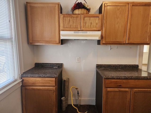 kitchen with dark stone countertops