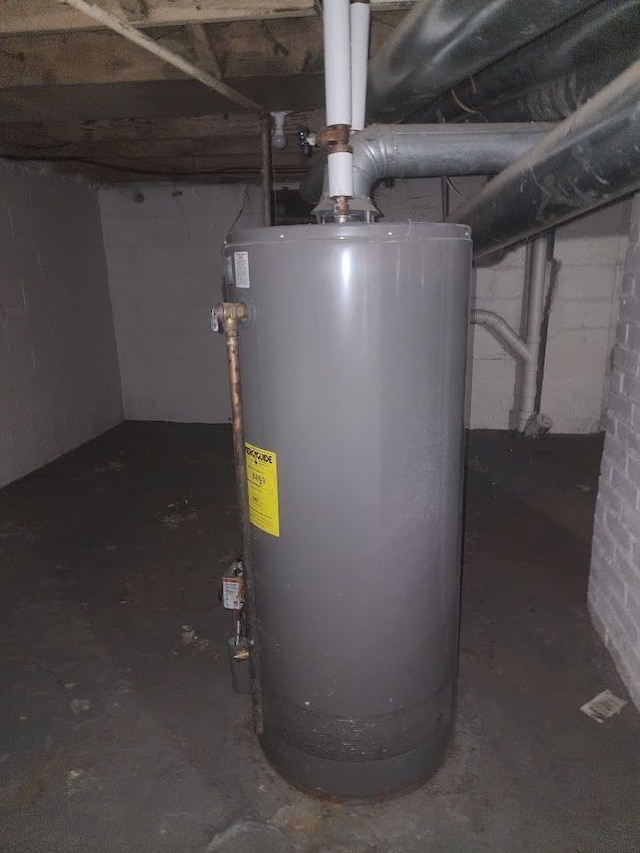 utility room featuring gas water heater