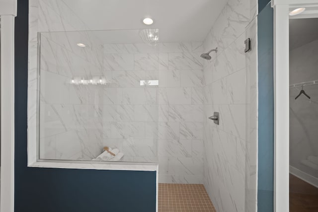 bathroom with tiled shower