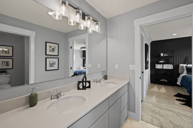 bathroom with vanity and toilet