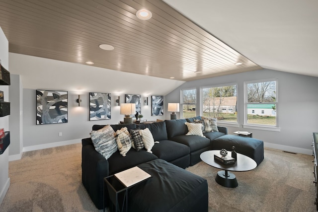 carpeted living room with wood ceiling and vaulted ceiling