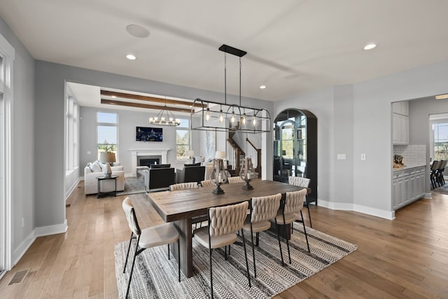 dining space featuring plenty of natural light and light hardwood / wood-style flooring