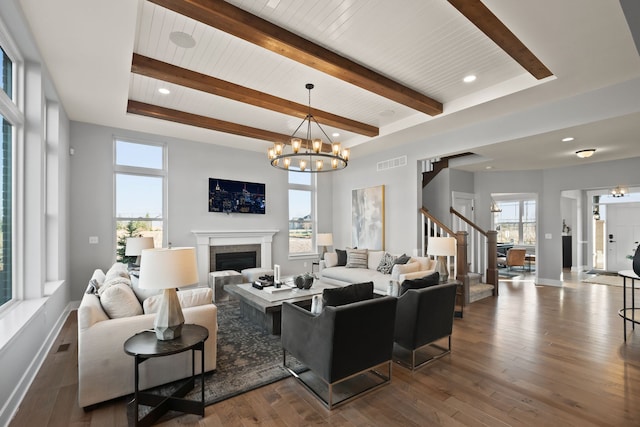 living room featuring plenty of natural light and dark wood-type flooring