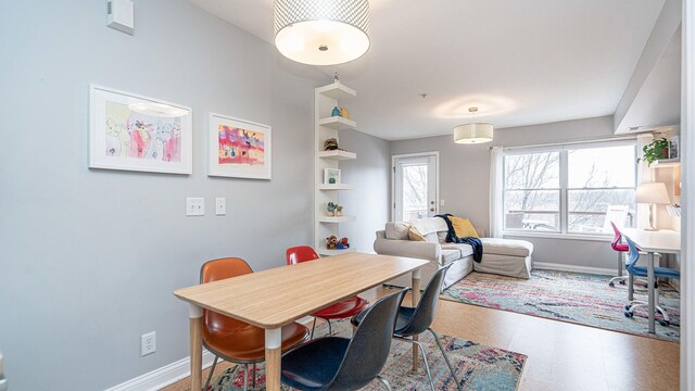 560 Little Lake Dr Unit 19, Ann Arbor, MI 48103 - dining area featuring baseboards and tile patterned floors