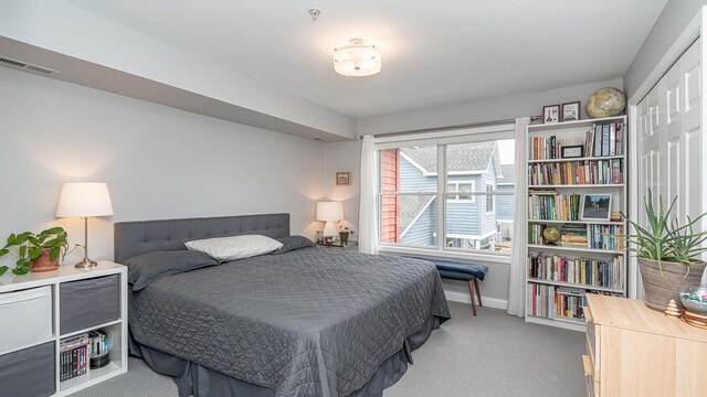 560 Little Lake Dr Unit 19, Ann Arbor, MI 48103 - bedroom featuring carpet flooring and baseboards