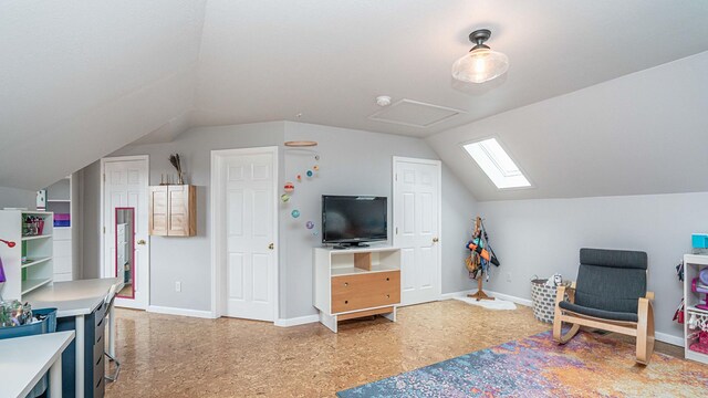 560 Little Lake Dr Unit 19, Ann Arbor, MI 48103 - recreation room featuring lofted ceiling, a skylight, and baseboards
