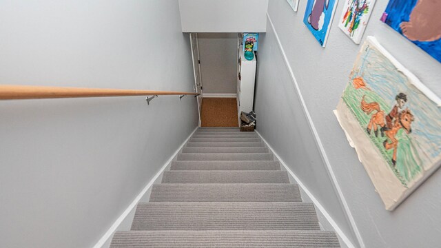 560 Little Lake Dr Unit 19, Ann Arbor, MI 48103 - stairway featuring carpet and baseboards