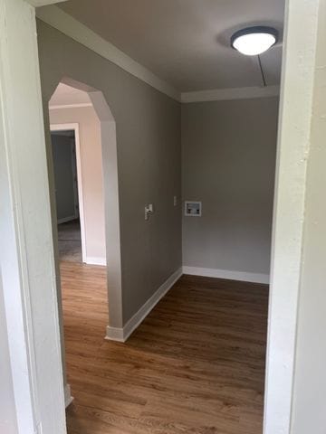 interior space with ornamental molding and dark wood-type flooring