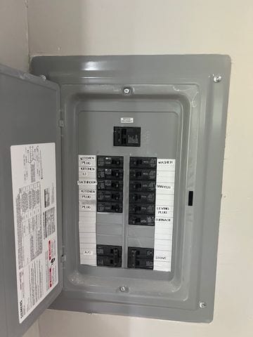 utility room featuring electric panel