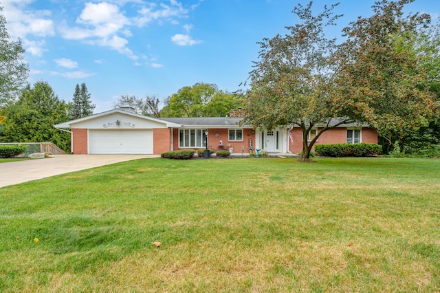 single story home with a garage and a front lawn