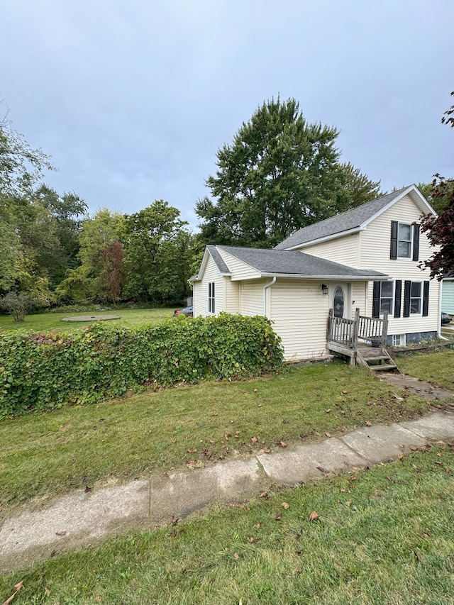 view of property exterior with a lawn