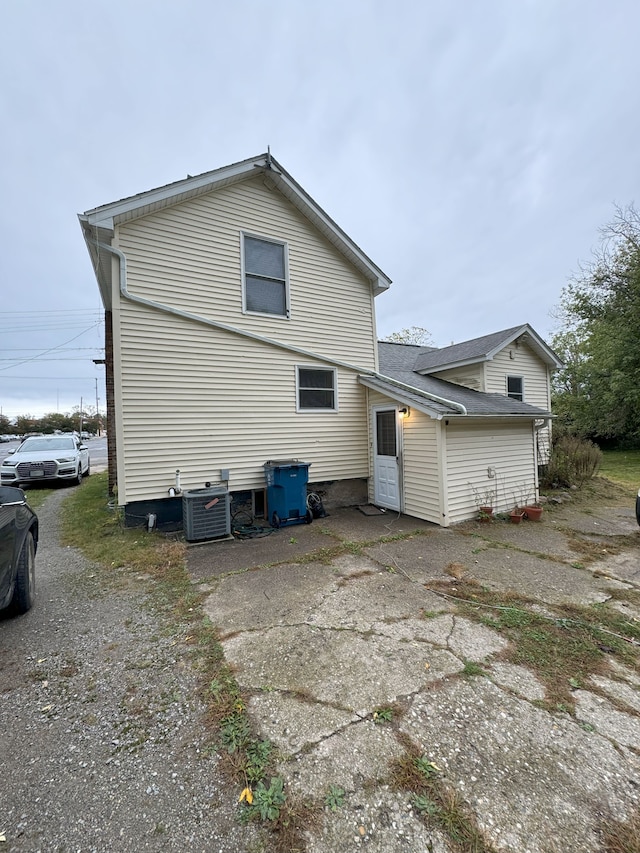 back of property with central AC unit